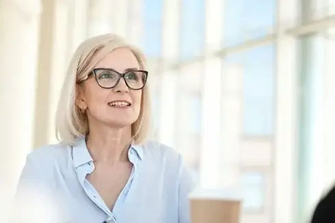mature female business leader smiling